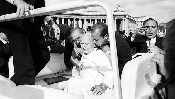 Pope John Paul II is assisted by aides after being shot in St. Peter’s Square in 1981. (CNS photo/L'Osservatore Romano)